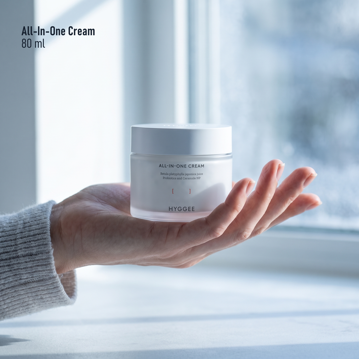 HYGGEE All-In-One Cream 80 ml, held in hand for scale